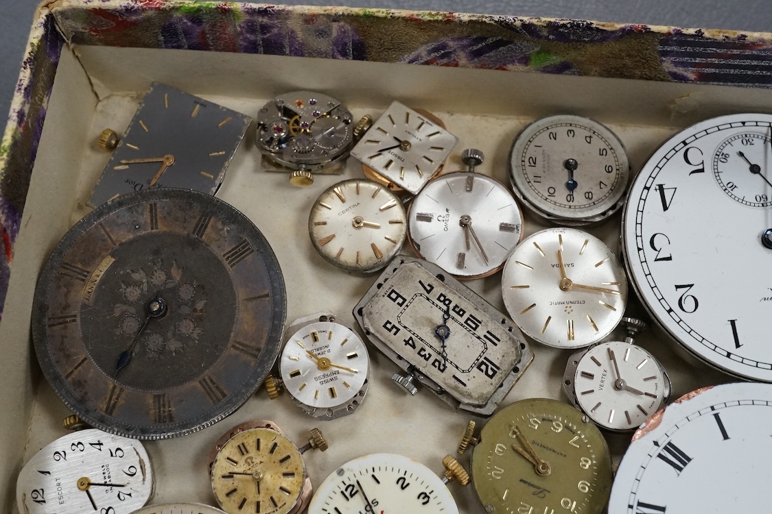 A quantity of assorted wrist and pocket watch movements, including Omega and Omega automatic, together with a pocket watch and a 935 white metal fob watch.